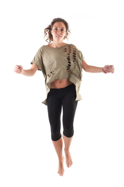 Beautiful brunette girl jumping over white background. Studio shot — Stock Photo, Image