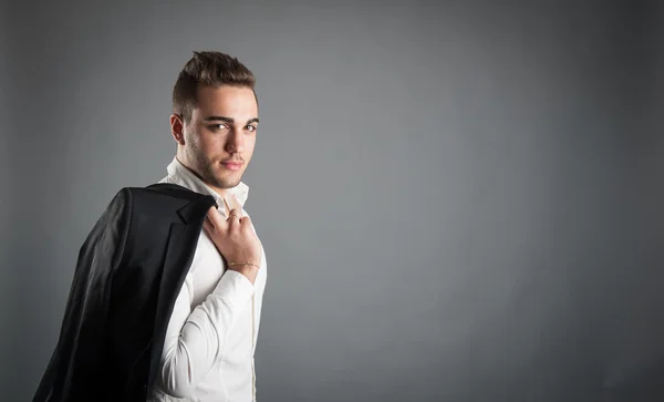 Young man close up portrait against grey background — Stock Photo, Image