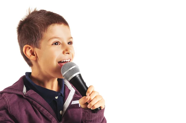 Child singing with microphone, isolated on white background — Stock Photo, Image