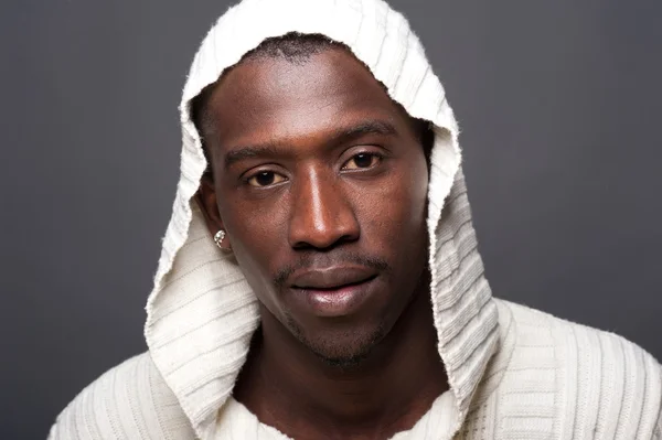 Young african man close up portrait against dark background. — Stock Photo, Image