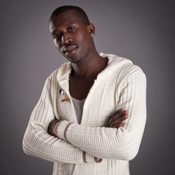 Young african man close up portrait against dark background. — Stock Photo, Image