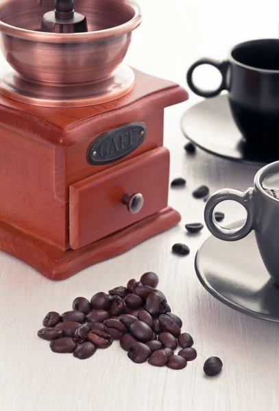 stock image Coffee cup with coffee grinder