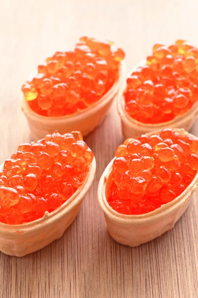 Caviar red , scattered in four waffle capitula — Stock Photo, Image