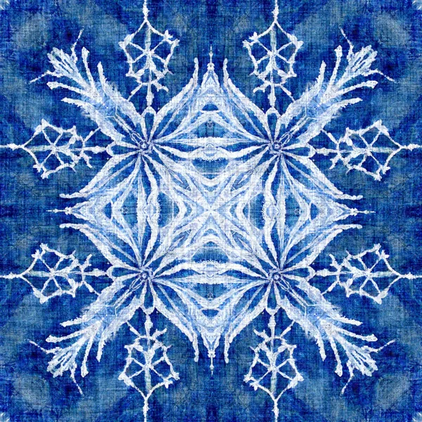 Indigo blue snow flake pattern background. Frosty batik painterly effect seamless backdrop. Festive cold holiday season wall paper tile