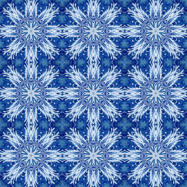 Indigo blue snow flake damask pattern background. Frosty painterly effect seamless backdrop. Festive cold holiday season wall paper tile