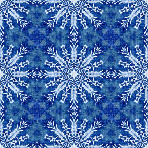 Indigo blue snow flake damask pattern background. Frosty painterly effect seamless backdrop. Festive cold holiday season wall paper tile