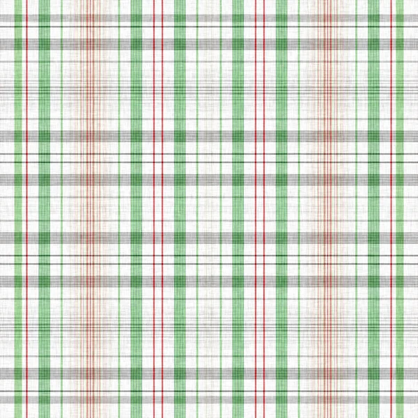 Christmas knit wool tartan background pattern. Traditional Scottish plaid for seasonal holiday texture effect. Seamless winter red and green melange all over print