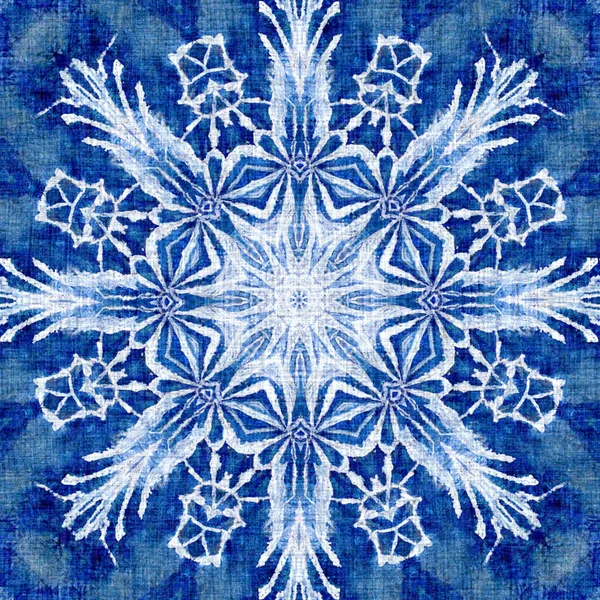 Indigo blue snow flake pattern background. Frosty batik painterly effect seamless backdrop. Festive cold holiday season wall paper tile