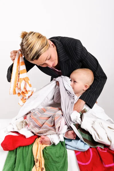 Mother and her son doing laundry — Stock Photo, Image