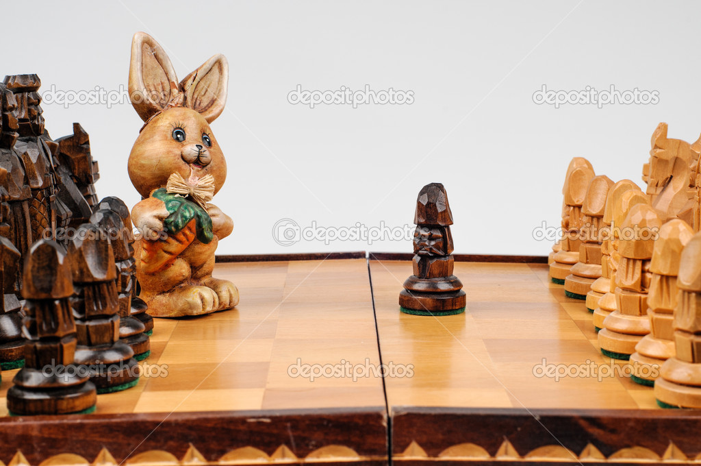 carved hare among the chess pieces