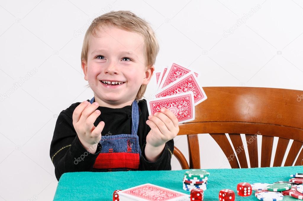 boy playing poker