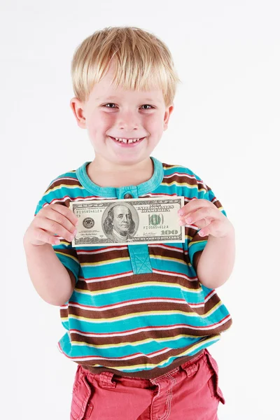 Boy holding a bank note — Stock Photo, Image