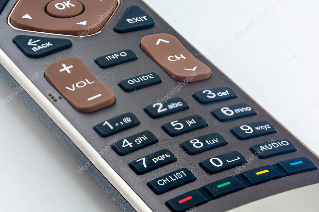 remote control from the TV on a white background. Close-up of a TV remote control.