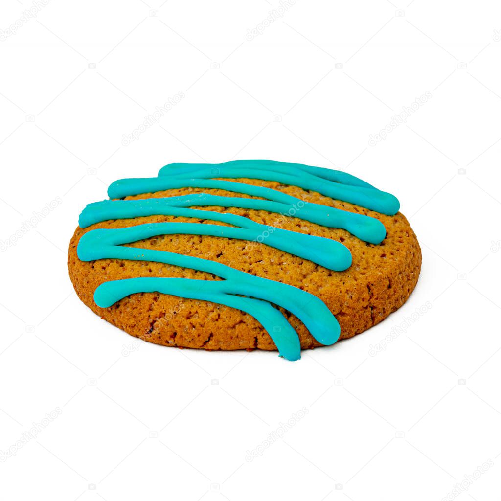 One round biscuit decorated with icing. Object against white background.