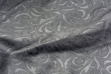 Deri yerine siyah soyut bir arkaplan. Siyah deri desenli bir arka plan. Kapat..