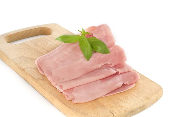 Baked ham with slices on wooden board — Stock Photo, Image