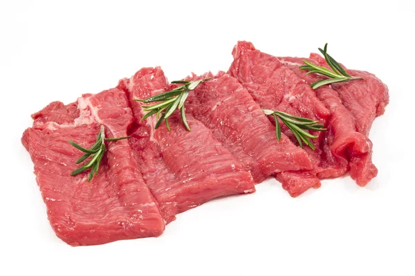 Rohes frisches Fleisch in Scheiben geschnitten mit Rosmarin — Stockfoto