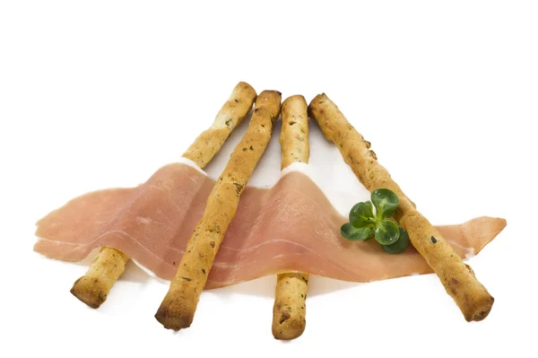 Italian prosciutto on a bread stick — Stock Photo, Image