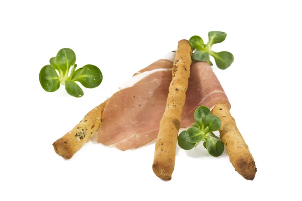 Italian prosciutto on a bread stick — Stock Photo, Image