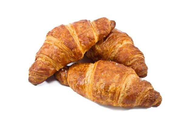 Croissant sobre fundo branco — Fotografia de Stock