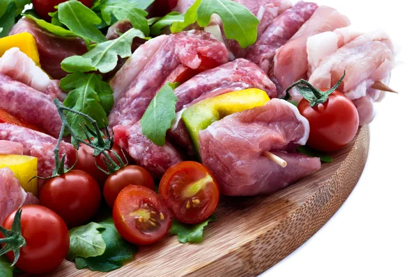 Fresh butcher cut and tomatoes meat assortment garnished — Stock Photo, Image