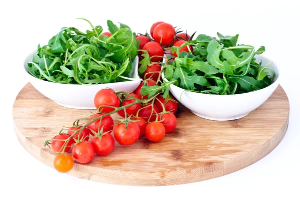 Tomatoes and rucola in white cups — Stock Photo, Image