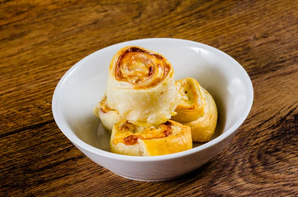 Rolled pie on wooden table — Stock Photo, Image