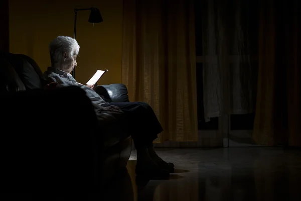 Aged woman with an open book — Stock Photo, Image