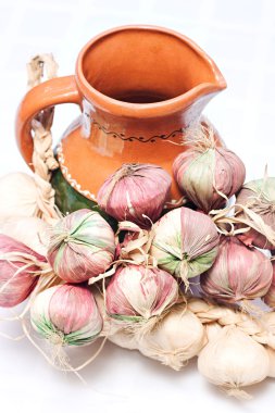A jug and garlic clipart