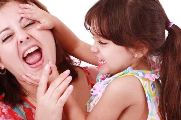 Young mother playing with her baby daughter. Focus on the mothe — Stock Photo, Image