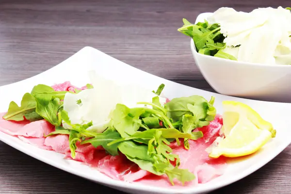 Meat carpaccio on the table — Stock Photo, Image