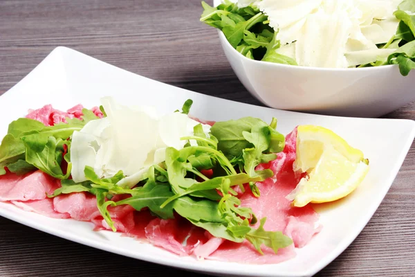 Meat carpaccio on the table — Stock Photo, Image