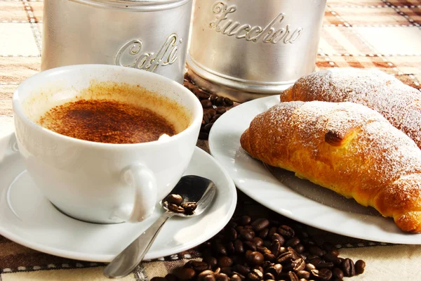 Brioches with cup of coffee and sugar — Stock Photo, Image