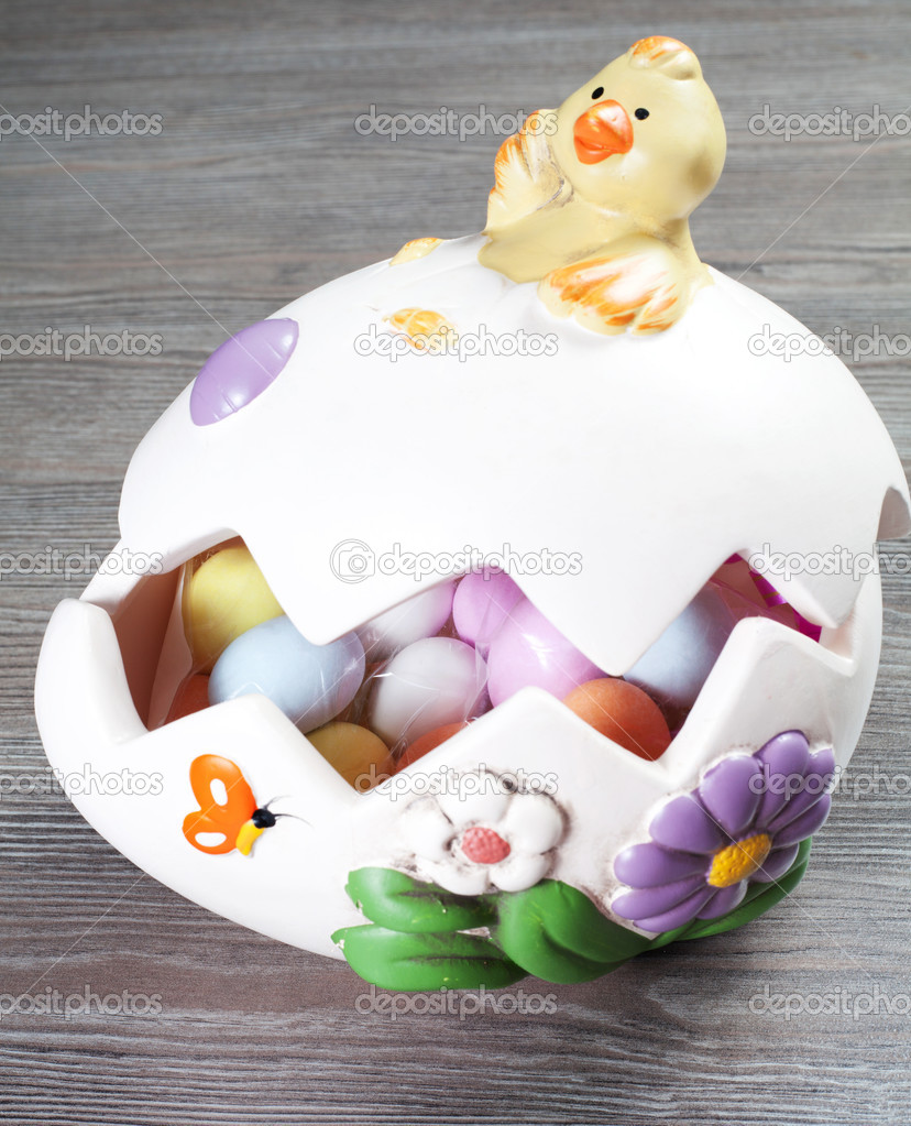 Colorfull eggs in the egg shaped eith chick