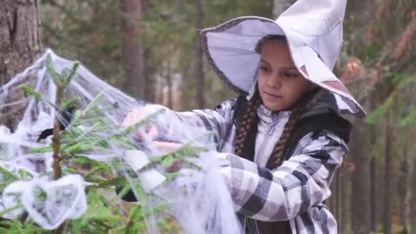 Girl Witch Hat Plaid Shirt Decorates Christmas Tree Celebration Halloween — Stock Video