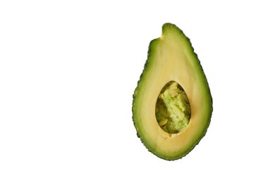 fresh whole and sliced avodcado fruit on light background isolated creative minimalism