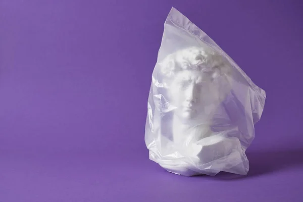 David Head Transparent Plastic Bag Purple Background Copy Space Art — Fotografia de Stock