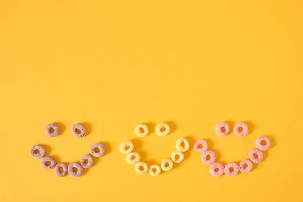 Colored Breakfast Cereals Laid Out Shape Smiley Face Yellow Background — Stock Photo, Image