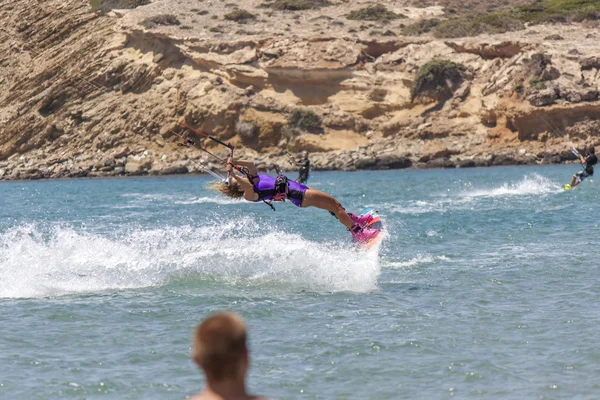 A young girl with kite surfing — Stock Photo, Image