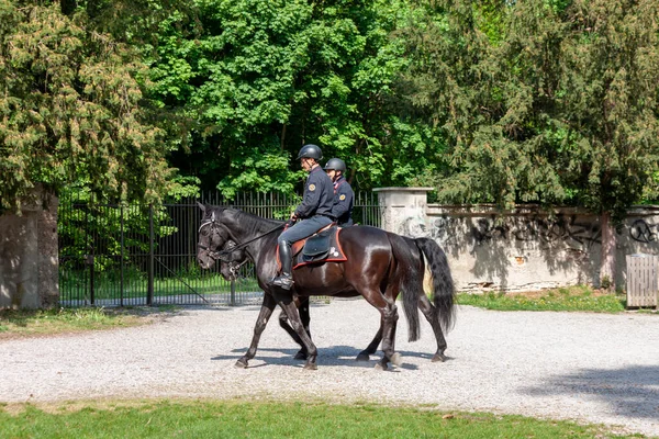Monza, Province of Monza and Brianza, Italy - May,  5, 2022. Carabinieri on horseback check security inside the park of Royal Palace (Villa Reale).