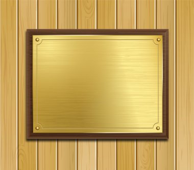 Brass Plaque On a Wood Panel Background clipart