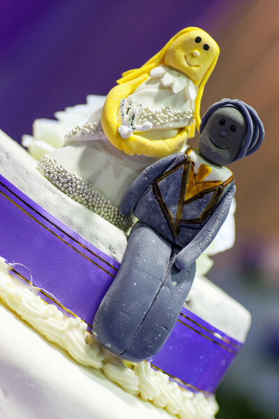 Bride and Groom cake toppers on a wedding cake decoration