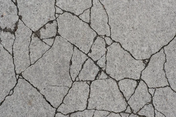Грандж текстурований бетонний тротуар з тріщинами — стокове фото