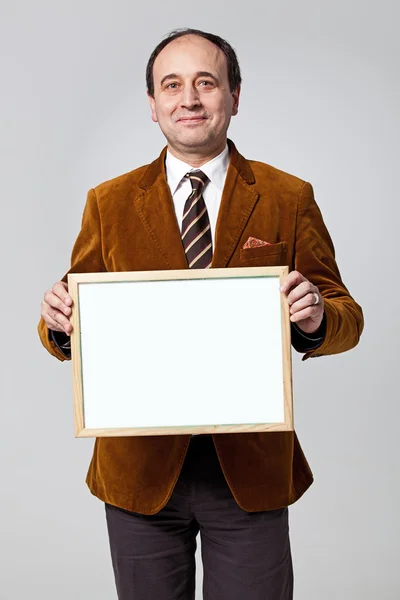 Mature Teacher Showing a Blank Board — Stock Photo, Image