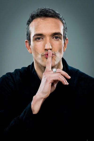 Young Man with Serious Expression Doing a Silent Sign — Stock Photo, Image