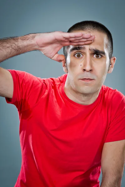 Ung man gör militar salut — Stockfoto