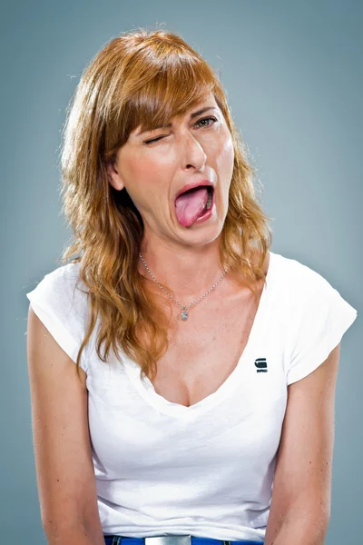 Young Happy Woman Sticking Out Her Tongue — Stock Photo, Image