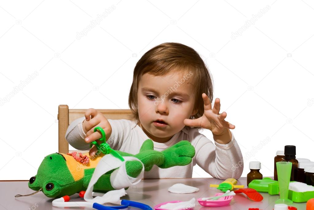 Girl playing as doctor with her toys 3