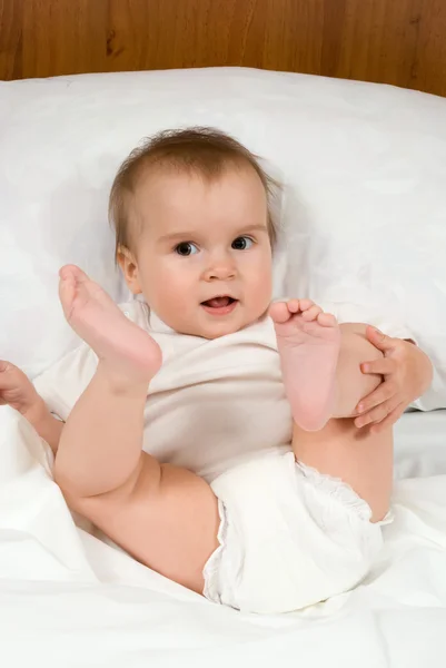 Little cute baby lying in bed — Stock Photo, Image