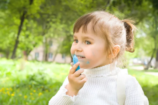 Cute little hellion girl with blue chalk — Stock Photo, Image